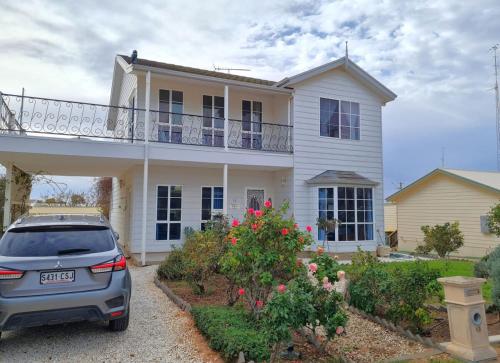 a car parked in front of a house at Jennie's Place in Port Moonta