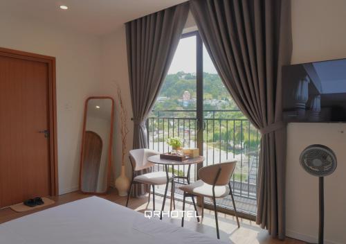 Voodi või voodid majutusasutuse QR Hotel Dalat toas