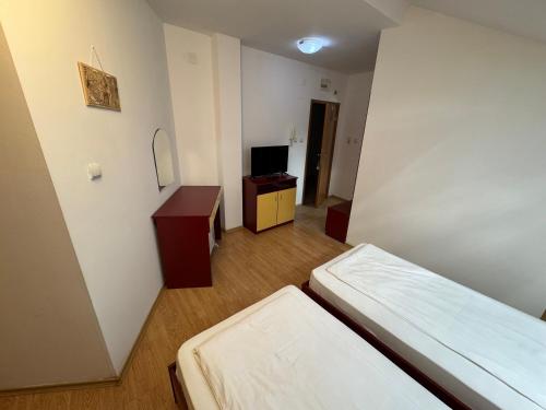 Postel nebo postele na pokoji v ubytování Todorini Kuli Apartments