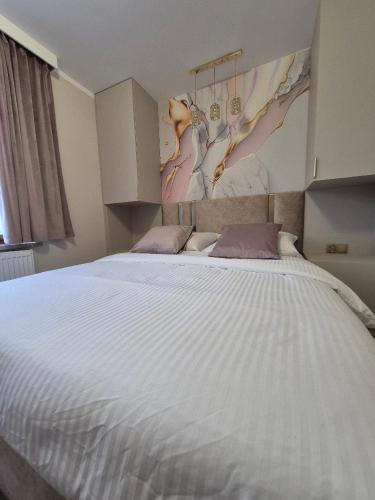 Ένα ή περισσότερα κρεβάτια σε δωμάτιο στο Apartament AMETYST