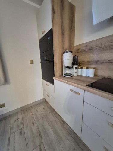 Η κουζίνα ή μικρή κουζίνα στο Apartament AMETYST