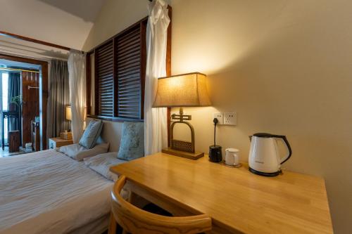 Ein Bett oder Betten in einem Zimmer der Unterkunft 枕窗听雨Homestay