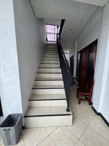 a staircase in a building with a stair case at Canggu 77 Guest House in Badung