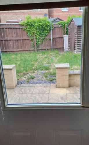 a view of a backyard from a window at Family Room in a 2 bed room house in Thornaby on Tees