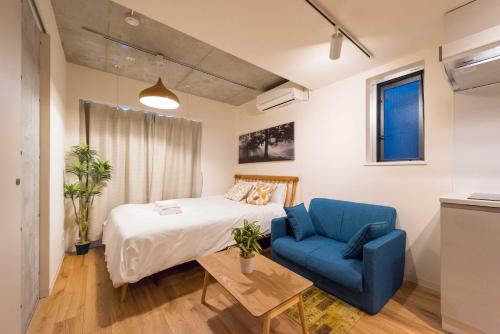 Postel nebo postele na pokoji v ubytování Fare Metallo Tokyo Nakano 11-room Hotel