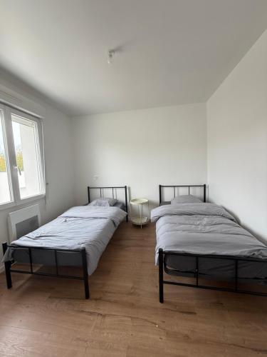 Ένα ή περισσότερα κρεβάτια σε δωμάτιο στο Appartement moderne et spacieux 3