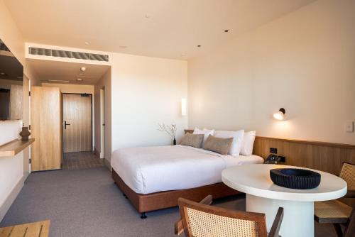 a hotel room with a bed and a table at Monarto Safari Resort in Monarto