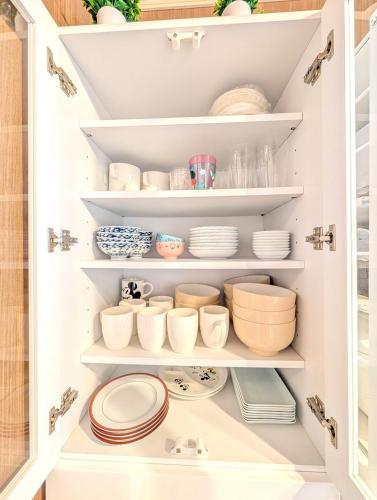 a kitchen pantry with plates and bowls on shelves at 17minutes by car to Nagoya-Sta 1parking in Chiharachō