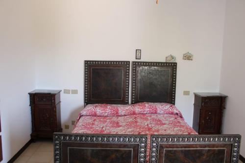 En eller flere senge i et værelse på Alla Villa