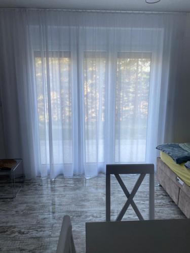 Ένα ή περισσότερα κρεβάτια σε δωμάτιο στο Apartman Leona A-1