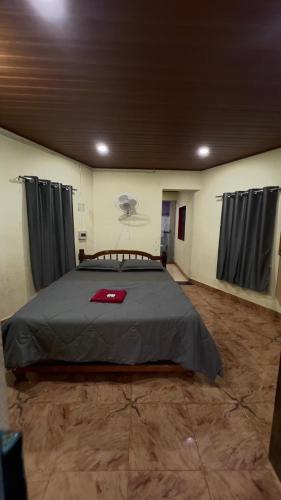a bedroom with a large bed in a room at Swarnagandha Cottages and Family rooms in Gokarna