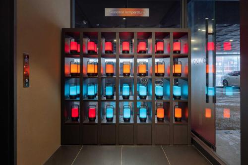 a display case with colored lights in a building at Ondo Hotel and Spa Jongno by Aank in Seoul