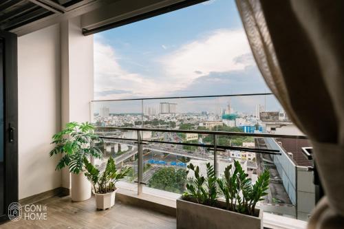 a view of the city from the balcony of a building at Luxury 2 or 3BR Apartment in Dist 1, Pool and airport pickup in Ho Chi Minh City