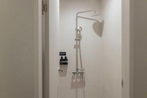 a shower with a shower head in a bathroom at Ondo Hotel and Spa Jongno by Aank in Seoul
