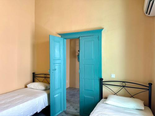 Postel nebo postele na pokoji v ubytování Lindiakos Villa AMI