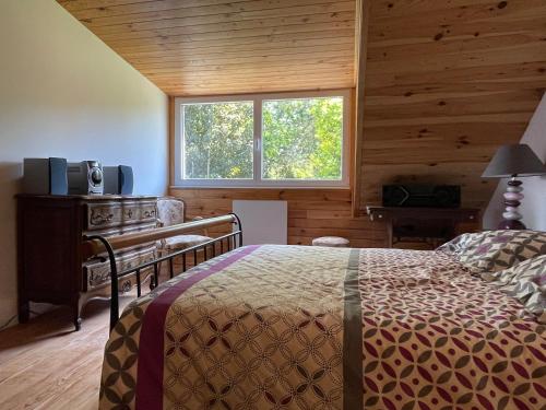 a bedroom with a bed and a window at Country house in Argol