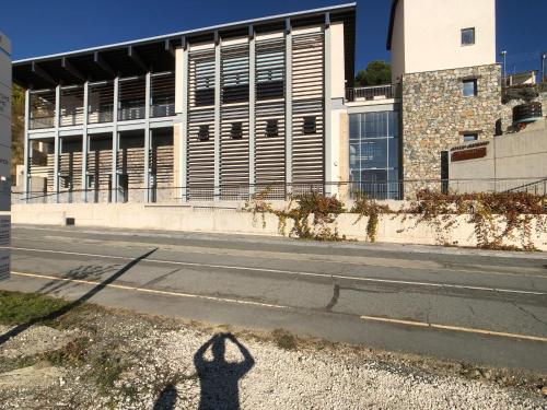 a shadow of a person standing in front of a building at Retreat Centre Cyprus in Zoopiyi