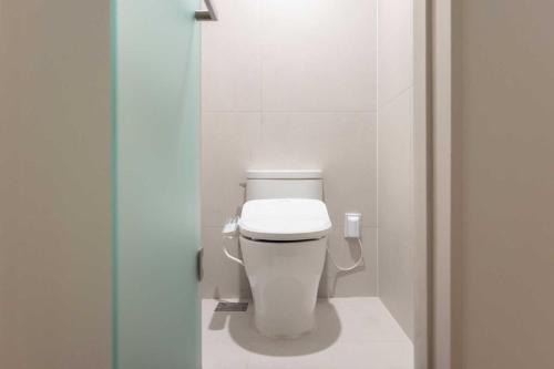 a bathroom with a white toilet in a stall at Ondo Hotel and Spa Jongno by Aank in Seoul