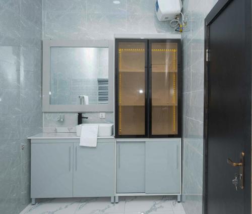 a bathroom with a sink and a mirror at luxury 3bed rooms duplex lekki Lagos nigeria in Lekki