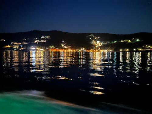 a view of a body of water at night at Luz del Mar in Kumbor