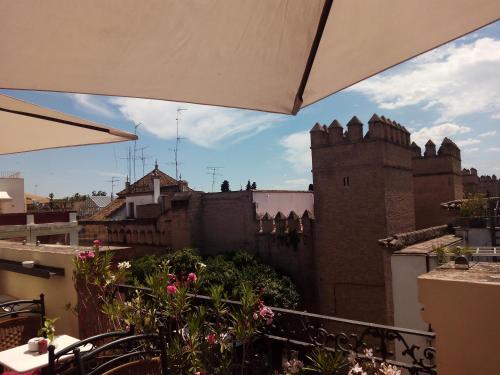 a view of a building from a balcony at Hotel Palacio Alcázar in Seville
