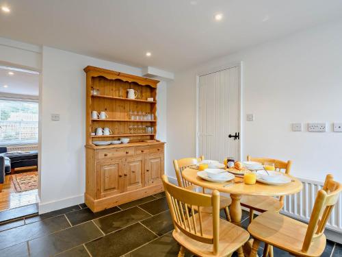 a dining room with a wooden table and chairs at 2 Bed in Long Melford 81320 in Long Melford