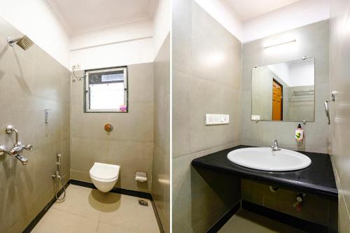 a bathroom with a sink and a toilet at FabHotel Cruz Royale - Nr- Bandra West in Mumbai
