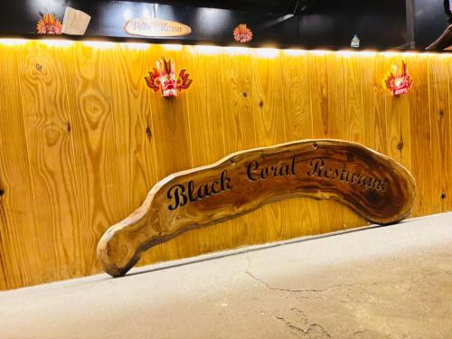 a wooden sign that says black equal resistance at Villa Mossa Ambalangoda Boutique villa in Ambalangoda