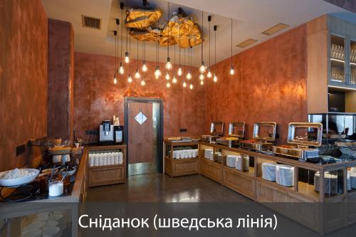 a restaurant with aasteryasteryasteryasteryasteryasteryasteryasteryasteryasteryasteryastery at Fomich Residence in Bukovel