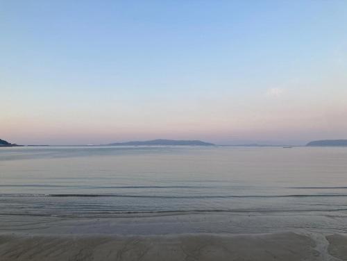a view of the ocean from the beach at ザビーチ in Wada