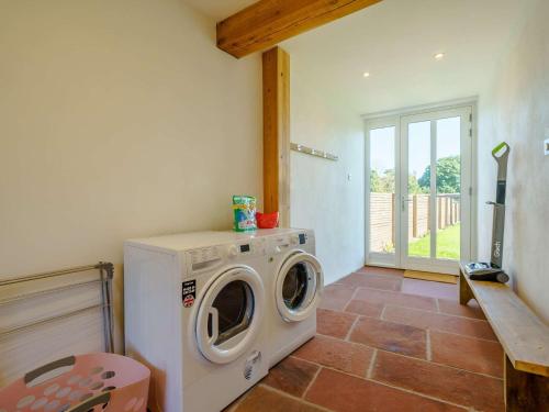 a washer and dryer in a room with a window at 3 bed property in Pooley Bridge 85362 in Pooley Bridge
