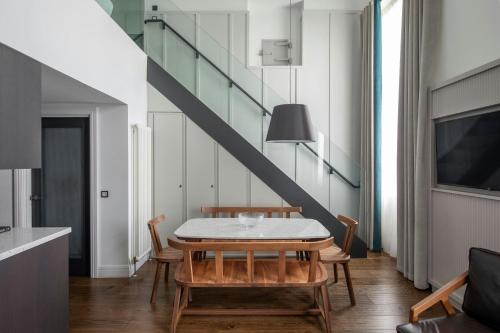 a dining room with a table and chairs at The Edinburgh Grand, a Luxury Collection Hotel, Edinburgh in Edinburgh