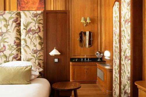 a hotel room with a bed and a sink at The Edinburgh Grand, a Luxury Collection Hotel, Edinburgh in Edinburgh