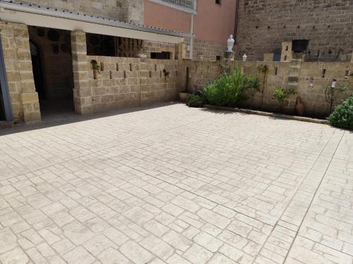 a brick courtyard in front of a building at Borgo Don Ciccio in Felline
