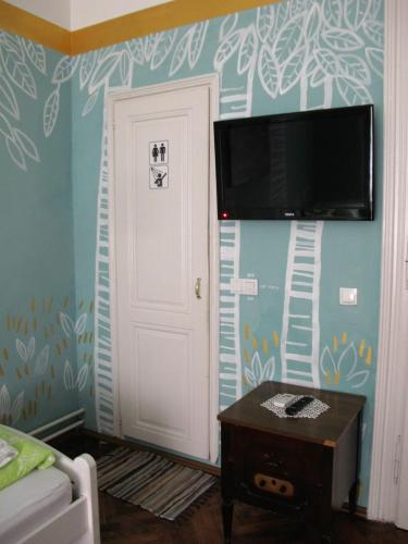 Un televizor și/sau centru de divertisment la Centar Guesthouse