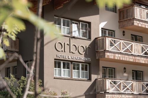 a building with balconies on the side of it at ARBOR Hotel & Apartments in Saalbach Hinterglemm