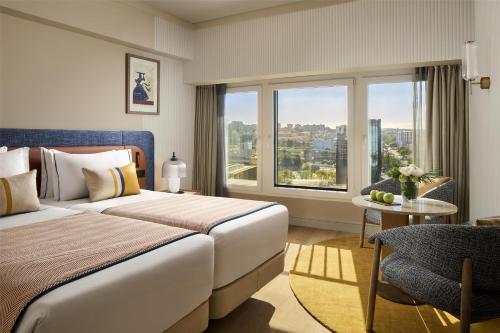 Un ou plusieurs lits dans un hébergement de l'établissement Tivoli Oriente Lisboa Hotel