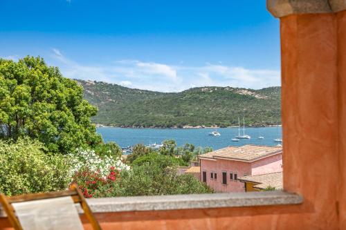 a view of a body of water from a window at BILANCIA VI 30' Porto Cervo & PRIVATE TERRACE with Sea View in Santa Teresa Gallura