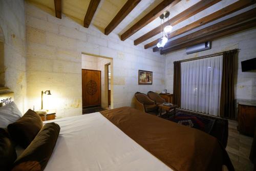 a bedroom with a large bed in a room at Harman Cave Hotel in Goreme