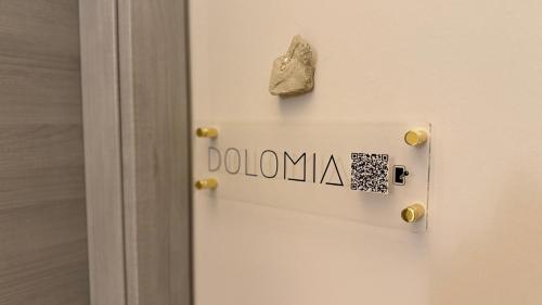 a door with a donation sign on it at A&F LUXURY Rooms Pinzolo in Pinzolo