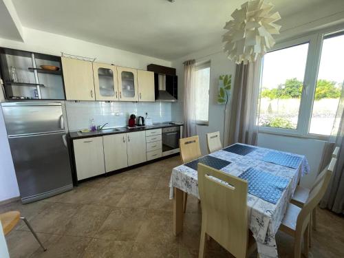 A kitchen or kitchenette at Caprice Apartment in Lozenec