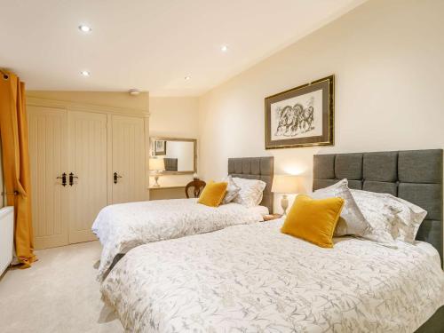 two beds sitting next to each other in a bedroom at 2 Bed in Rowlands Gill 89758 in Stanley