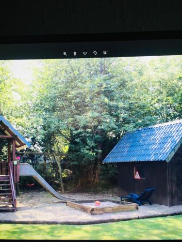 a view of a playground with a slide and a building at Natur pur 