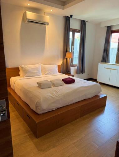 Ένα ή περισσότερα κρεβάτια σε δωμάτιο στο Beachfront Villa