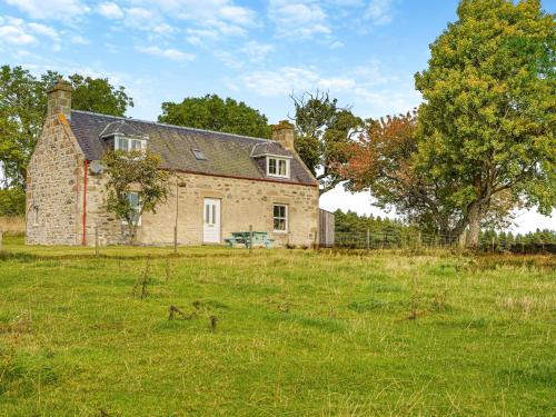 an old stone house in a field of grass at 3 bed in Carron CA227 in Carron