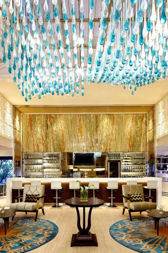 a large lobby with a large chandelier at Sheraton Bandung Hotel & Towers in Bandung