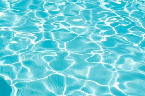 a close up of blue water in a pool at Salida apartment in Alghero