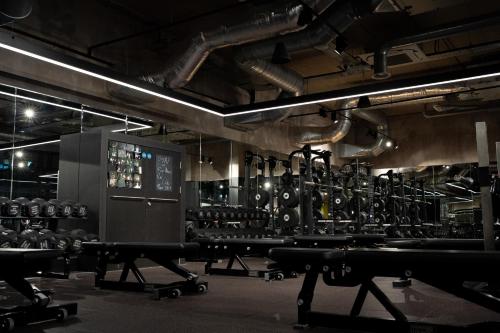 a large room with a gym with lots of equipment at Luxury City Retreat Perfect for Business & Families & Free Gym By The Pocklington - The New Walk Suite in Leicester