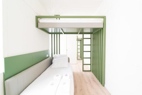 a room with a bed and a ladder at A'Mar by Alojamento Ideal in Póvoa de Varzim