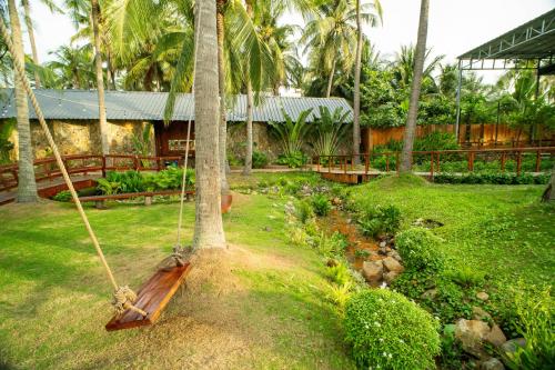 Jardín al aire libre en Nirvana Beach Villages